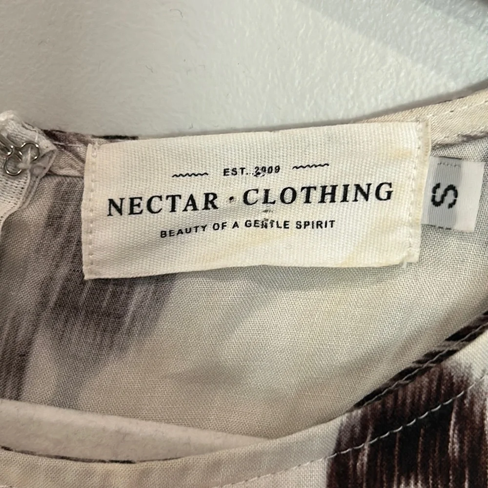 Nectar Clothing size small cream and black side cut out dress